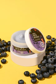 Elemen jar of moisturizer with blueberries on a yellow background for boy & men